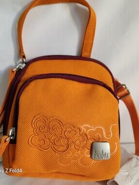 Haiku Orange Crossbody with Plum Trim and Embroidered Swirls